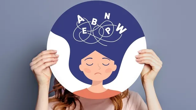 manos femeninas sosteniendo un póster con una ilustración de una niña con dislexia