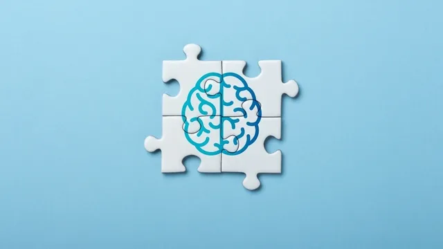 ilustración de un cerebro en piezas de rompecabezas que representa la mente y los conceptos cognitivos