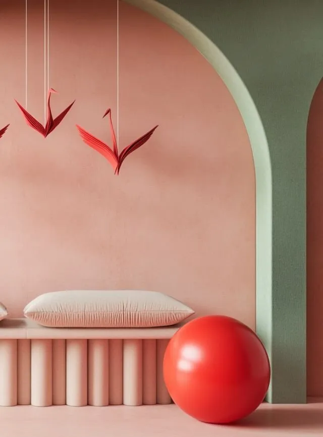 Espacio de interiorismo minimalista en tonos pastel con un banco geométrico y detalles decorativos colgantes