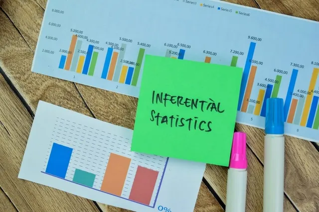 Concepto de estadística inferencial sobre un papel entre gráficos