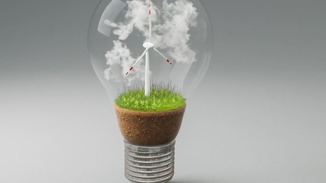 Imagen con una bombilla y en su interior un parque eólico